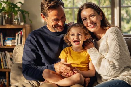 Illustrative image of a family sitting together in a warm home setting