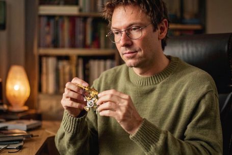 Illustrative image of an adult holding a mug in a quiet setting